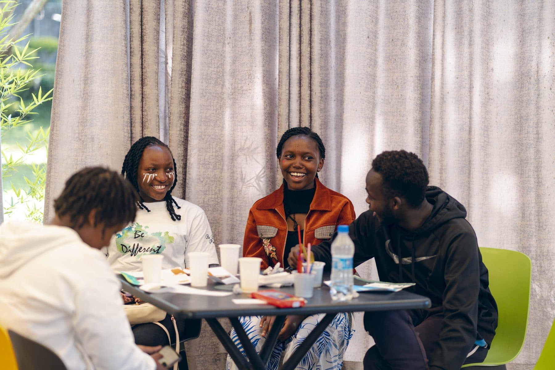 A group in conversation around a table in Nairobi