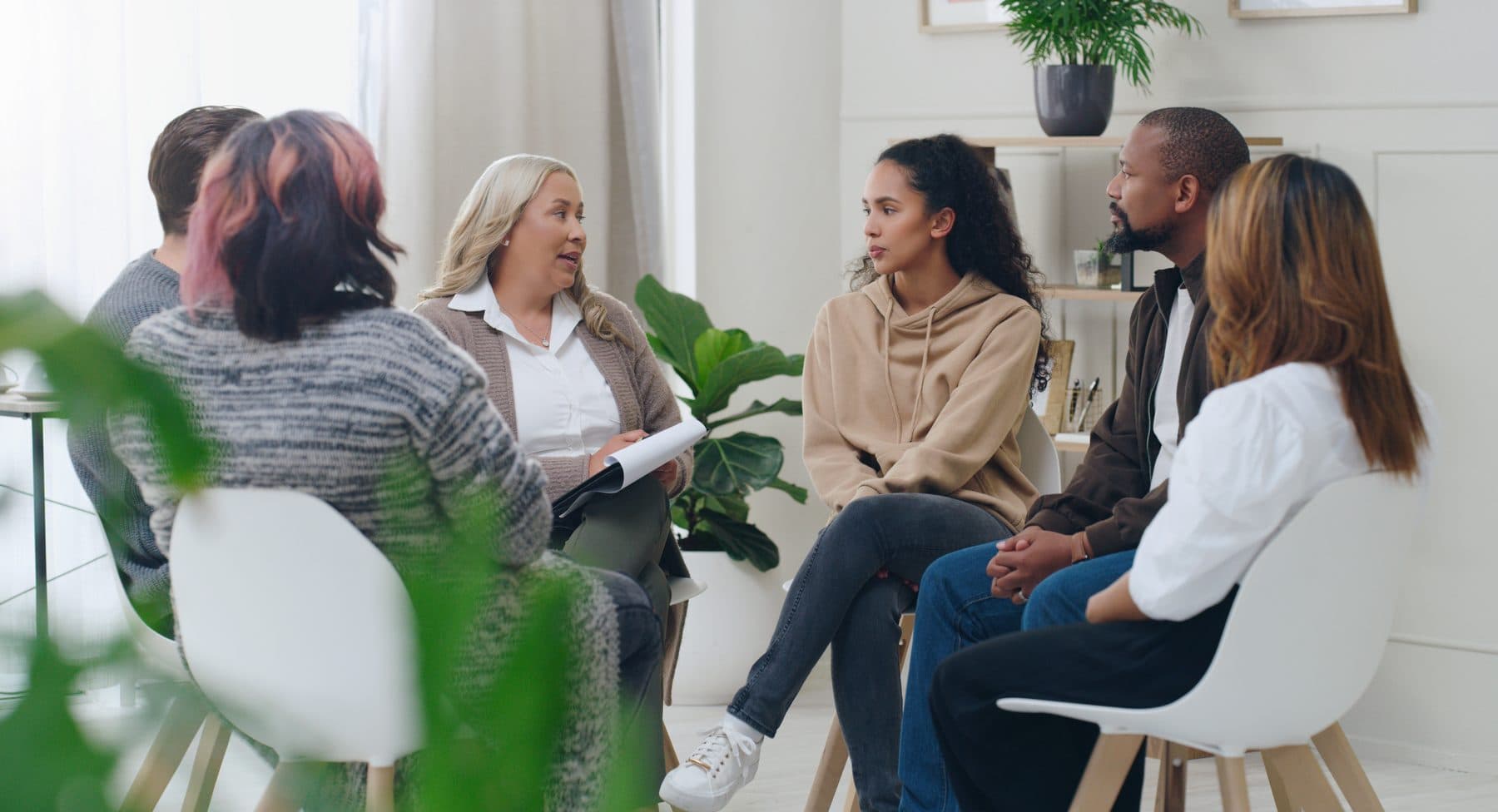 A facilitated circle, people seated together in conversation
